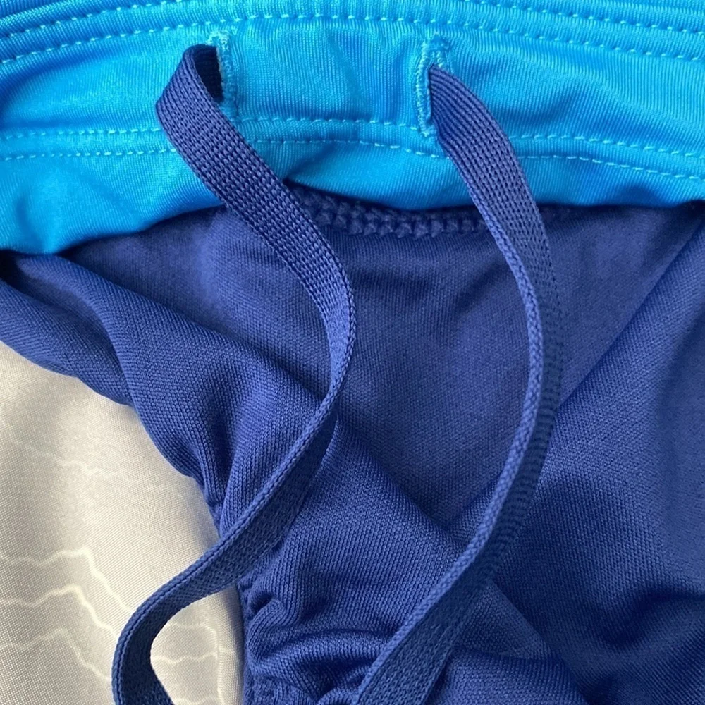 NIKE blue running shorts with small pocket and drawstrings Size S